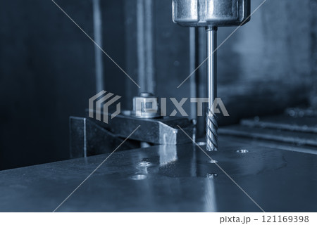 The hole boring process on CNC milling machine in the light blue scene. The hole boring process on CNC milling machine in the light blue scene. 121169398