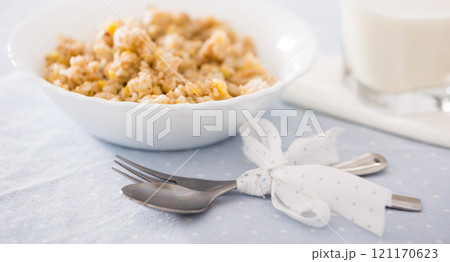 Plate with cereal porridge for breakfast Plate with cereal porridge for breakfast 121170623