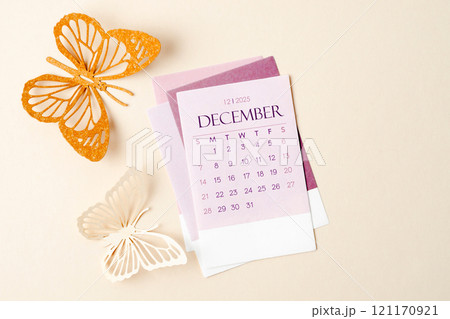 December 2025 calendar card for the organizer to plan and reminder and butterfly paper on yellow. 121170921