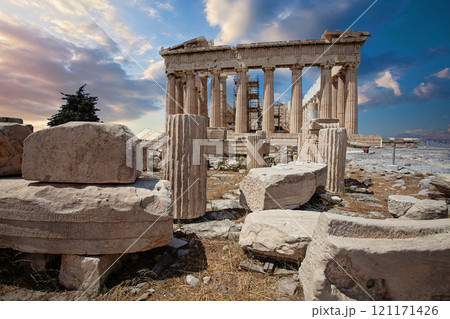 Ancient greek culture. Column and blue sunset sky clouds in Acropolis, Athens, Greece 121171426