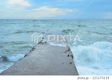 Background landscape view of Sudak Bay, the city of Sudak and its embankment in Crimea. 121173219