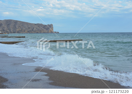 Background landscape view of Sudak Bay, the city of Sudak and its embankment in Crimea. 121173220