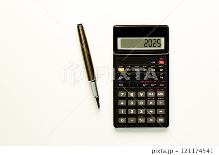 Business concept of 2025 new year symbol. Beautiful black calculator with number 2025. Beautiful white background, copy space. Beautiful black pen. Business 2025 happy new year concept. Business concept of 2025 new year symbol. Beautiful black calculator with number 2025. Beautiful white background, copy space. Beautiful black pen. Business 2025 happy new year concept. 121174541