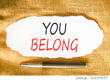 Belonging and you belong symbol. Concept words You belong on beautiful white paper. Beautiful canvas background. Beautiful metallic pen. Business belonging and you belong concept. Copy space. Belonging and you belong symbol. Concept words You belong on beautiful white paper. Beautiful canvas background. Beautiful metallic pen. Business belonging and you belong concept. Copy space. 121174577