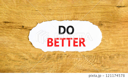 Do better symbol. Concept words Do better on beautiful white paper. Beautiful wooden background. Business and do better concept. Copy space. Do better symbol. Concept words Do better on beautiful white paper. Beautiful wooden background. Business and do better concept. Copy space. 121174578