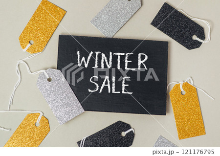 Black sign with the word Winter Sale written on it Black sign with the word Winter Sale written on it 121176795