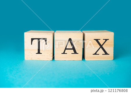 Three wooden blocks with the word tax written on them 121176808