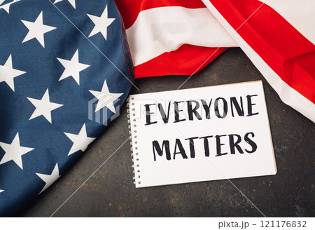 White piece of paper with the words everybody matters written on it 121176832