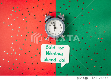 Clock is on a green background with a red background 121176837