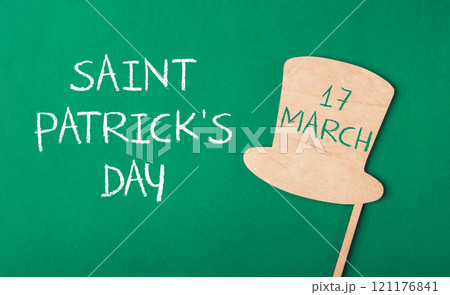 Green background with a wooden hat and the words Saint Patrick's Day on it Green background with a wooden hat and the words Saint Patrick's Day on it 121176841