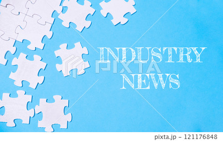 Jigsaw puzzle with the word Industry News written on it 121176848