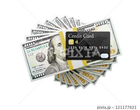 Overhead of Credit Card on Top of One Hundred Thousand Dollars Spiralling Stacks of One Hundred Dollar With Red Bow Bills Isolated on a White Background. 121177821