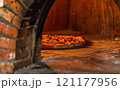 Neapolitan pizza, freshly cooked in a wood-burning oven. 121177956