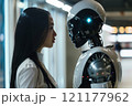 A woman is observing the robots facial features like jaw and eyelashes 121177962