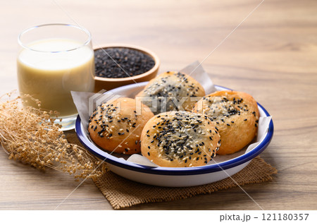 Asian deep fried dough filled with black sesame paste eaten with soy milk, Thai style 121180357