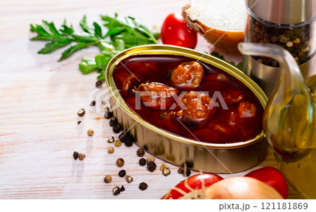 Opened tin can of scallops 121181869