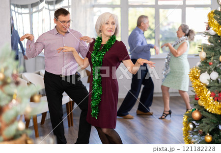 Adult man and elderly woman dance twist 121182228