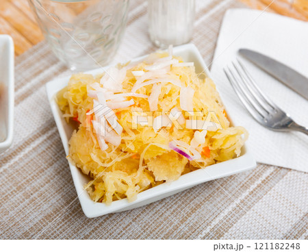 Homemade pickled cabbage on white plate closeup, natural probiotic Homemade pickled cabbage on white plate closeup, natural probiotic 121182248