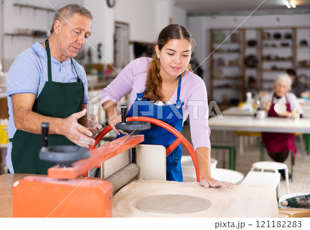 potter in workshop is working with student potter in workshop is working with student 121182283