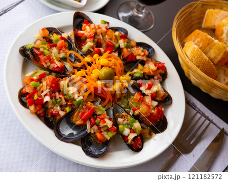 Tasty mussels with vinaigrette from fresh vegetables, nobody 121182572