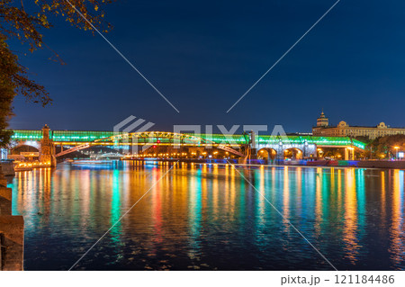 Pushkinskiy bridge with night illumination. Bridge to Gorky Park. Pushkinskiy bridge with night illumination. Bridge to Gorky Park. 121184486