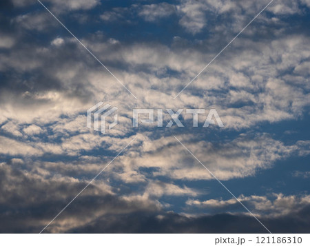 Blue sky with white clouds. Clear skies with scattered clouds on a sunny day. Blue sky with white clouds. Clear skies with scattered clouds on a sunny day. 121186310