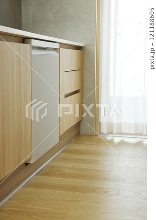 A minimalist interior in wood tones with warm sunlight streaming in. A minimalist interior in wood tones with warm sunlight streaming in. 121188605