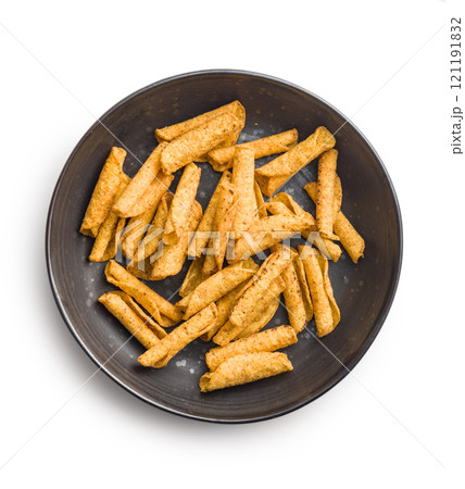 Rolled nachos tortilla chips on plate isolated on white background. Rolled nachos tortilla chips on plate isolated on white background. 121191832
