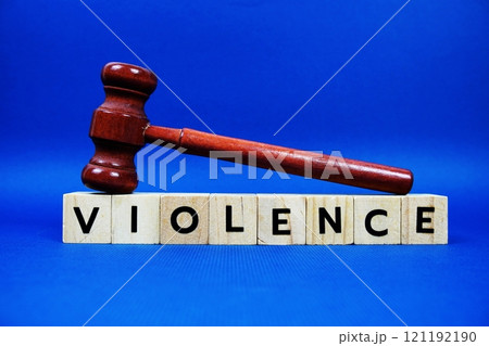 Violence alphabet letters with wooden blocks alphabet letters and Gavel on blue background 121192190
