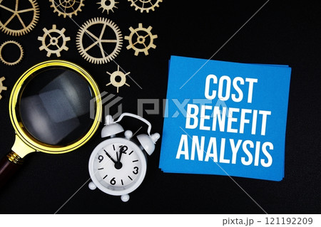 CBA - Cost Benefit Analysis text message on sticky note with magnifying glass and alarm clock on black background CBA - Cost Benefit Analysis text message on sticky note with magnifying glass and alarm clock on black background 121192209
