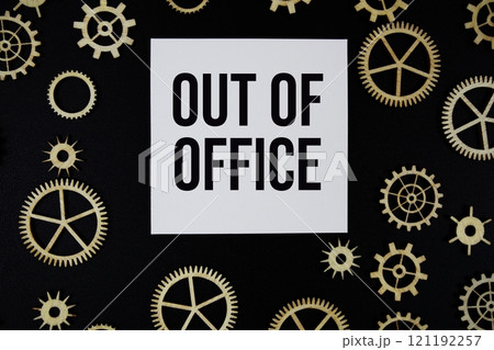 Out of Office text on paper and gear on black background Out of Office text on paper and gear on black background 121192257