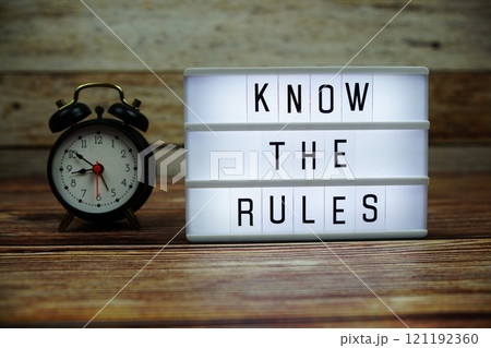 KNOW THE RULES letterboard text on LED Lightbox on wooden background, Business and Communication concept background 121192360