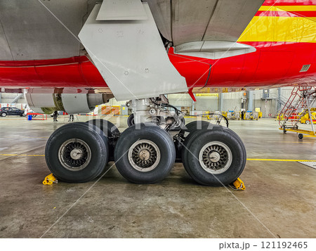 Aircraft Landing Gear Close-Up in Maintenance Hangar with Six Wheels. High quality photo 121192465