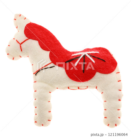 Handmade red and white felt horse toy with embroidery details isolated on white Handmade red and white felt horse toy with embroidery details isolated on white 121196064