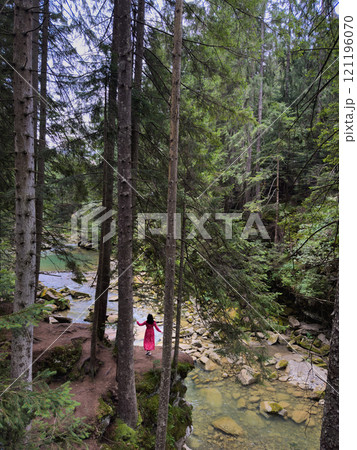 Woman in Red Dress by Serene Forest River 121196070