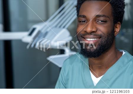 Dentist preparing for oral examination in clinic setting Dentist preparing for oral examination in clinic setting 121196103