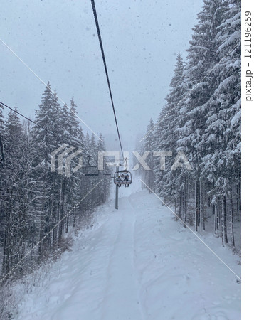 Snowy Ski Lift in Winter Forest 121196259