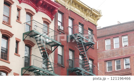 New York City building architecture, Manhattan. Residential house exterior. Red brick, fire escape. New York City building architecture, Manhattan. Residential house exterior. Red brick, fire escape. 121196466