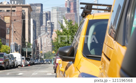 New York City. Row of yellow Taxi cars on street, Queens. Taxi cabs, Long Island. Medallion taxicab. 121196568