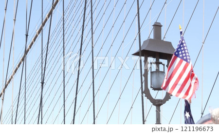 American flag on Brooklyn Bridge to Manhattan, New York City. Patriotic symbol. Travel USA. 121196673