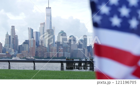 New York City waterfront skyline, Manhattan Downtown World Trade Center cityscape. American USA flag New York City waterfront skyline, Manhattan Downtown World Trade Center cityscape. American USA flag 121196705