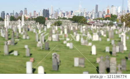 New York City Calvary cemetery in Queens, USA. Manhattan Midtown skyline. Tombstones on graves. 121196774