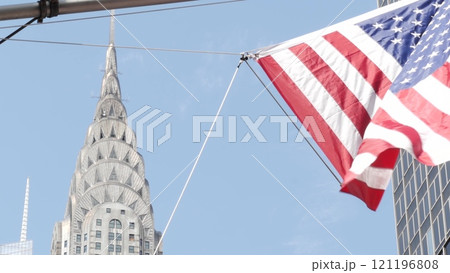 New York, american flag waving. Chrysler building. Manhattan midtown city street banner, patriotism. New York, american flag waving. Chrysler building. Manhattan midtown city street banner, patriotism. 121196808