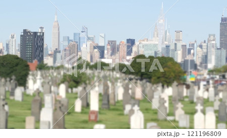 New York City Calvary cemetery in Queens, USA. Manhattan Midtown skyline. Tombstones on graves. 121196809