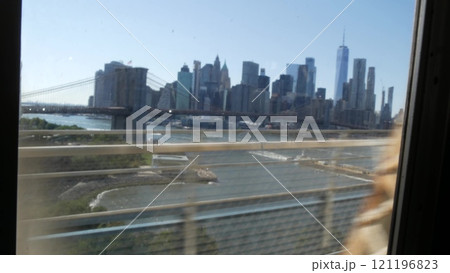 New York City subway train on bridge. Manhattan metro transport, metropolitan traffic. Shaking window 121196823