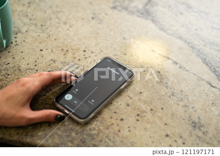 Fraud or fraudulent schemes. Close-up of a woman's hand holding a phone with an unexpected incoming call from an unknown person Fraud or fraudulent schemes. Close-up of a woman's hand holding a phone with an unexpected incoming call from an unknown person 121197171