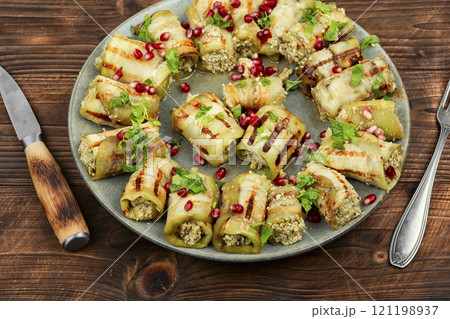 Delicious stuffed eggplant rolls. 121198937