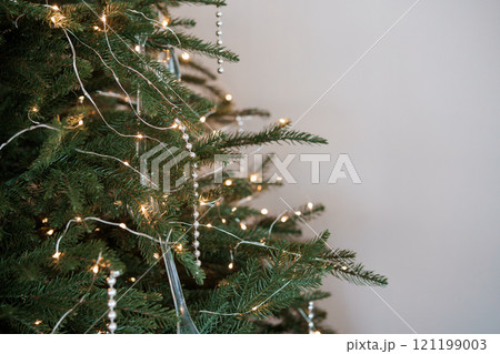 Elegant Christmas Tree Adorned with Lights and Beads 121199003