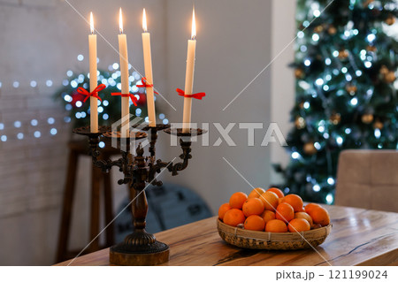 Festive Holiday Table Setting with Candles and Oranges 121199024