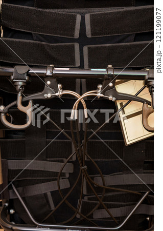 Intricate System of Harnesses and Attachments on a Wheelchair Intricate System of Harnesses and Attachments on a Wheelchair 121199077